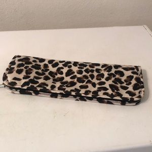 Modella curling or flat iron heat protector and holder.